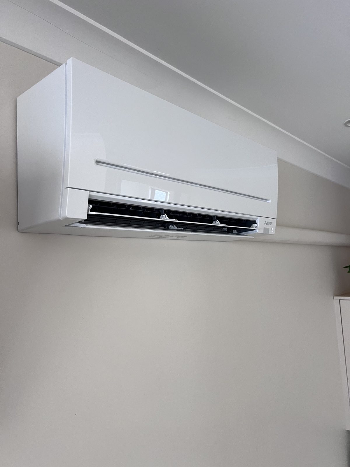 Clean wall-mounted Mitsubishi split system indoor unit